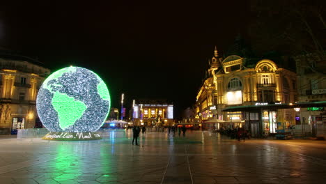 Night-lapse-of-Montpellier-comedy-square-with-world-globe-illumination.-Opera